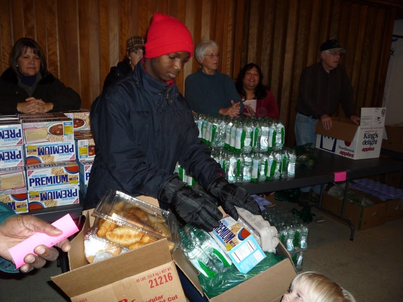 volunteers organizing food boxes and food in winter