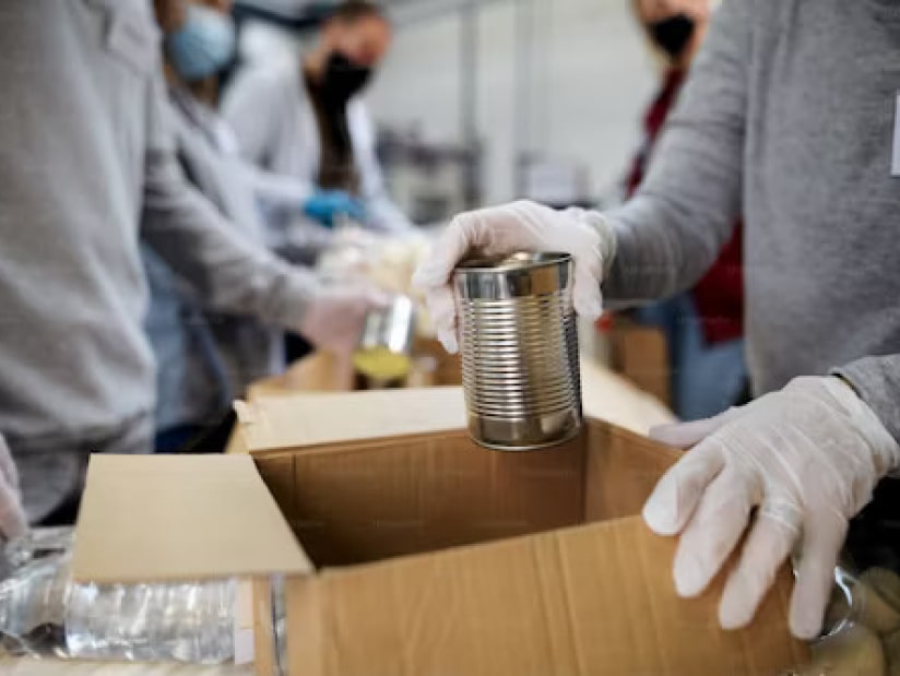 volunteers packing boxes of food