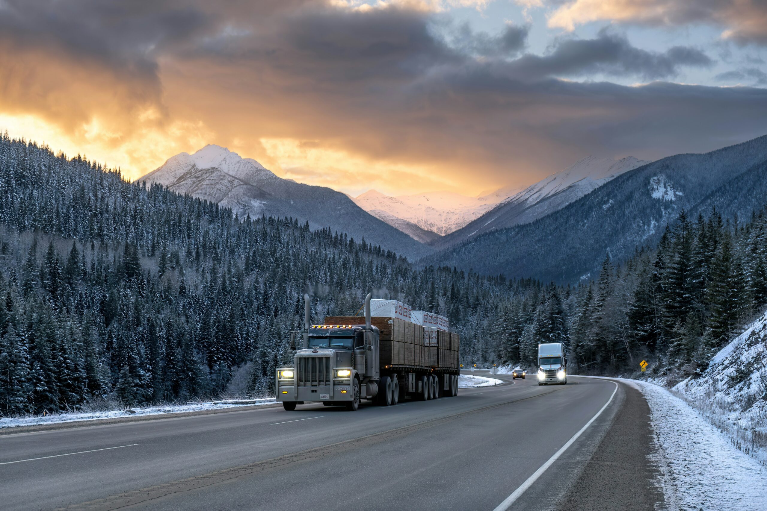 trucks driving through mountains of alberta