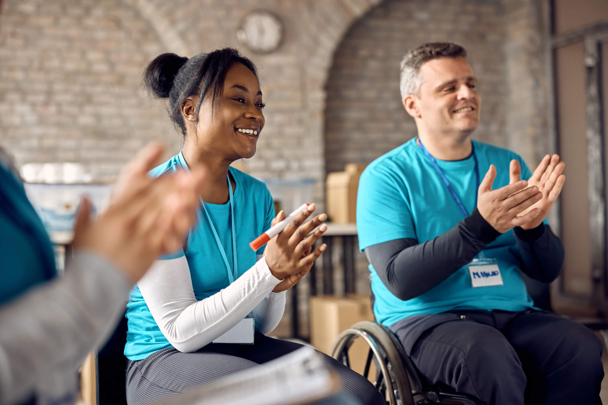 volunteers celebrating and clapping with one another